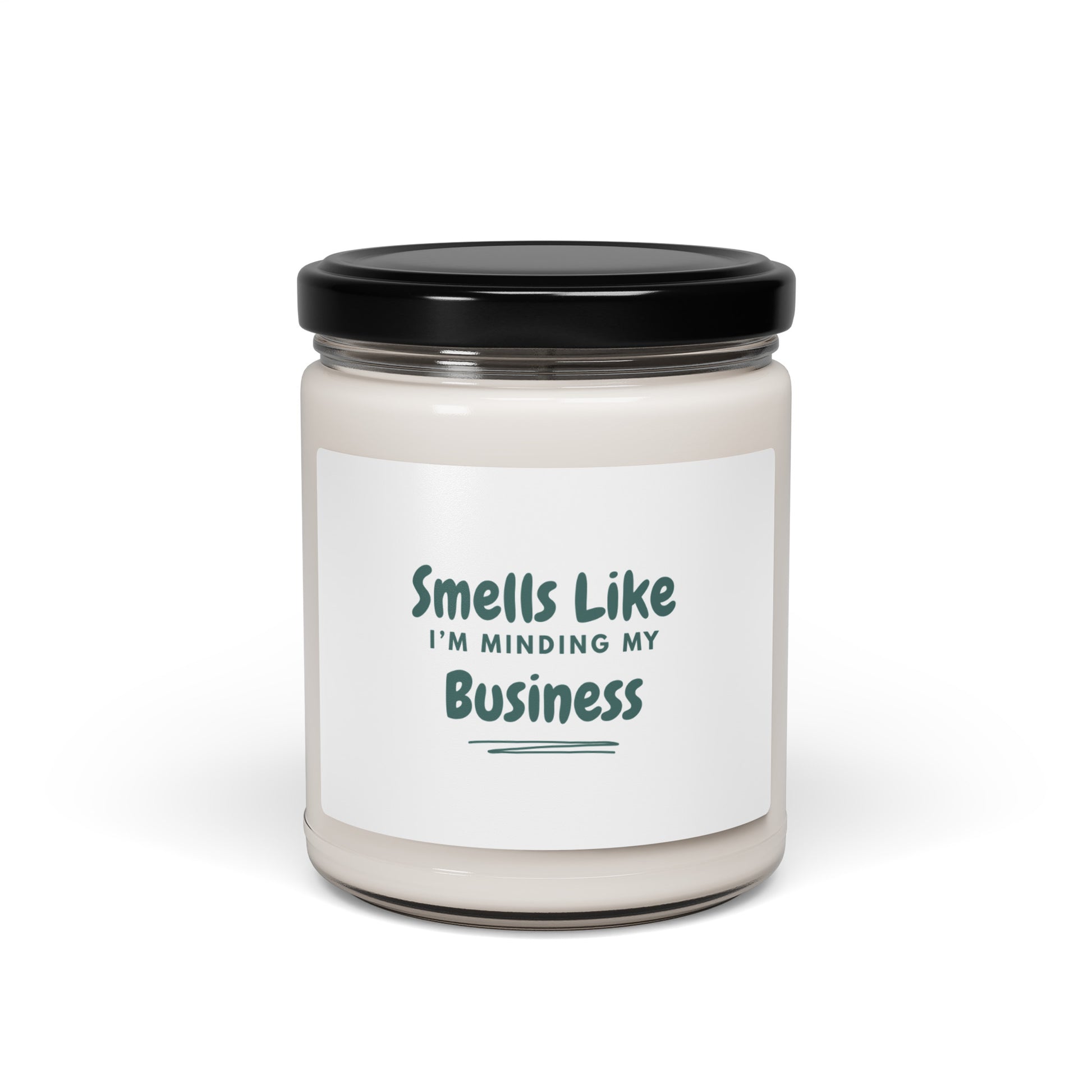 Candle jar with a label reading 'Smells Like I'm Minding My Business' on a white background