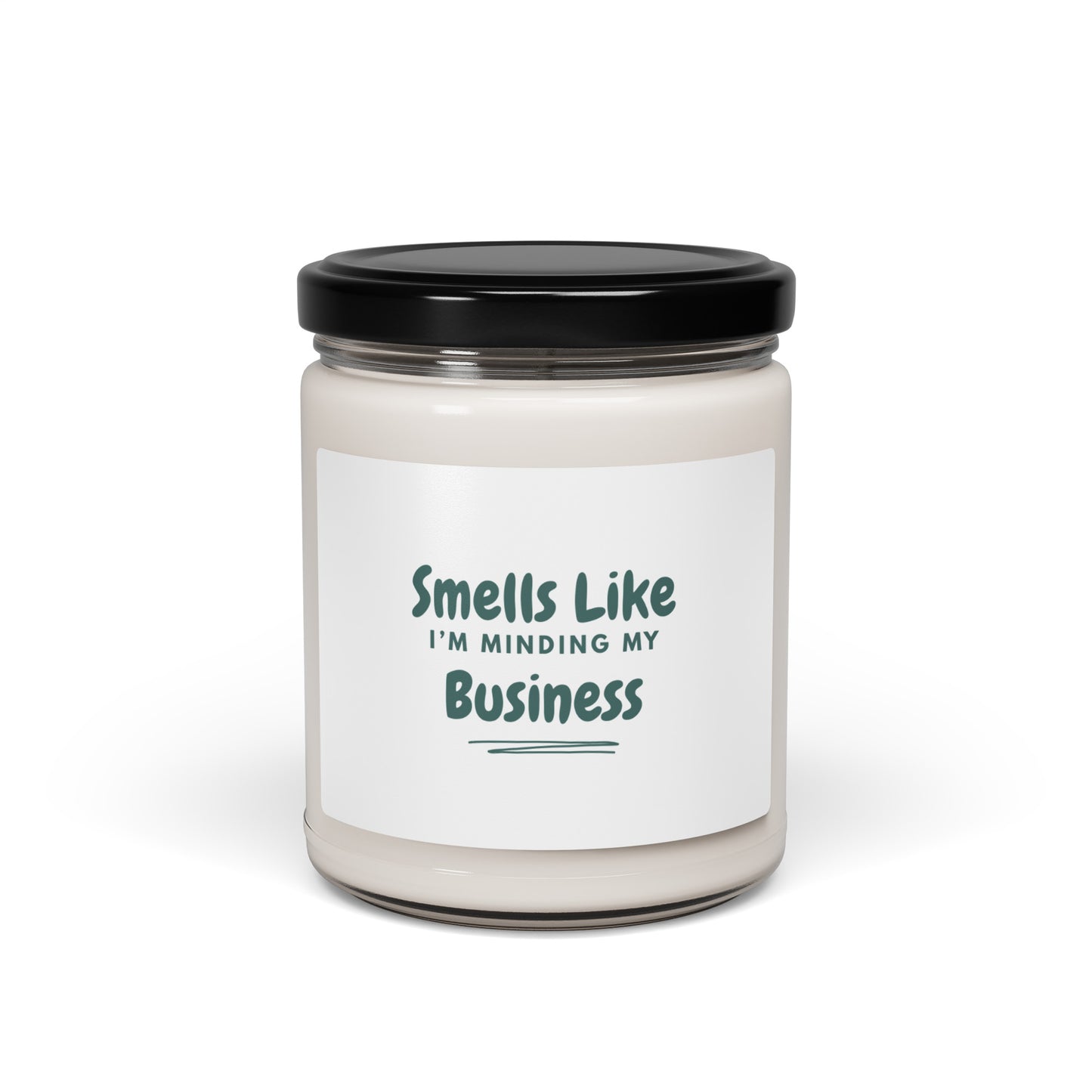 Candle jar with a label reading 'Smells Like I'm Minding My Business' on a white background